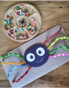 a paper plate with a spider made out of candy