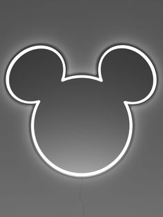 a mickey mouse light up sign on the wall