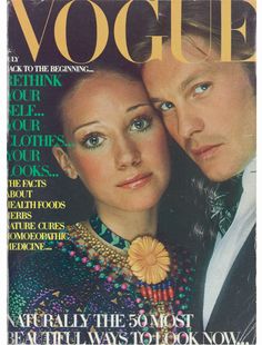 a magazine cover with a man and woman on the front, both looking at the camera