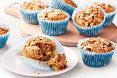 several muffins are sitting on a plate next to some other muffins