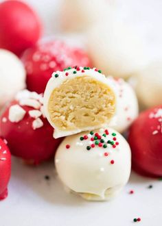 cake pops with sprinkles are stacked on top of each other and ready to be eaten