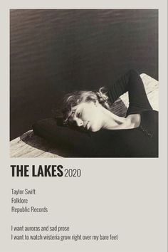 a black and white photo of a woman laying on a dock with the words, the lakes