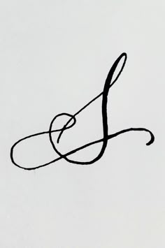 a black and white photo of the letter l in cursive writing on a sheet of paper