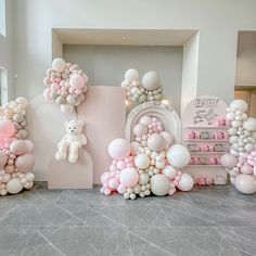 balloons are arranged in the shape of letters and teddy bears for a baby's first birthday party