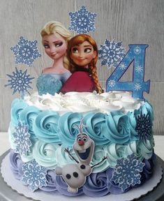 a frozen princess birthday cake with the number four on it and two characters in blue frosting