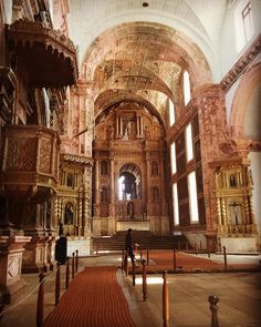 the inside of an old church with many windows