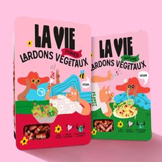 two packets of la vie are shown on a pink background