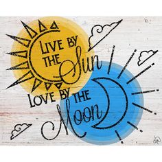 a wooden sign with the words live by the sun love by the moon on it