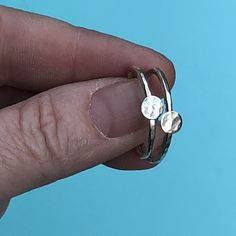 "This listing is for one delicate, hammered silver ring, size 7.25 or 8 US.  Please specify ring size at checkout. Each ring has a little hammered silver disc soldered to the ring. Each disc is approximately 3/16\" in diameter." Hammered Stackable Promise Rings, Hammered Stackable Round Promise Rings, Silver Stackable Rings With Hand Forged Round Band, Hammered Silver Stackable Promise Rings, Silver Hammered Stackable Promise Rings, Dainty Hand Forged Sterling Silver Stackable Rings, Minimalist Hammered Silver Stackable Rings, Everyday Hammered Sterling Silver Stackable Rings, Minimalist Hammered Sterling Silver Midi Rings