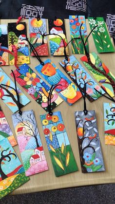 several colorful bookmarks are laid out on a table