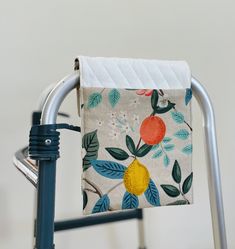 a close up of a folding chair with a towel on it's handlebars