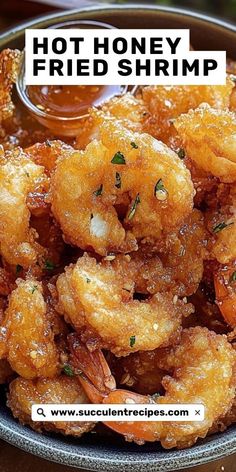 fried shrimp is served in a bowl with dipping sauce on top and the words, hot honey fried shrimp