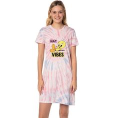 a woman wearing a pink tie dye shirt dress with the words nap vibes on it