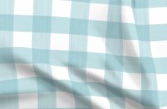 a blue and white checkered fabric is shown