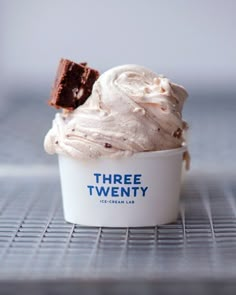 an ice cream sundae with two pieces of chocolate in it on a cooling rack