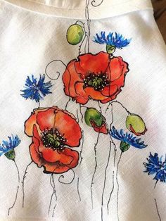 an image of red and blue flowers on white fabric