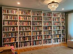 a living room filled with lots of books