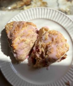 two pastries sitting on top of a white plate