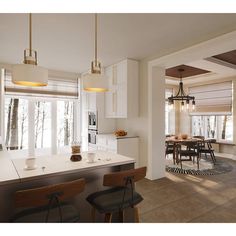 an open kitchen and dining room area with white cabinets, counter tops, and bar stools