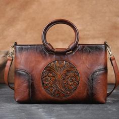 *Vintage-inspired bag with an eye-catching, structured silhouette. Beautifully handcrafted in luxurious leather and accented with our unique floral-tooling design, this handmade bag has the organizational features you'll love, and a personality you'll love to show off. *100% Authentic: A handcrafted Leather women's bag of stunning quality, meticulously stitched together into a gorgeous, timeless, and durable masterpiece that will stand up to daily wear and tear for many years to come. Handmade b Large Leather Handbags, Retro Handbags, Beg Tangan, Cross Bag, Women Handbag, Satchel Purse, Retro Stil, Bag Women, Styl Vintage