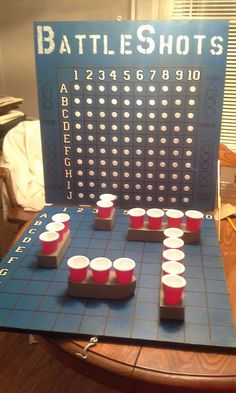 a board game set up with cups on it