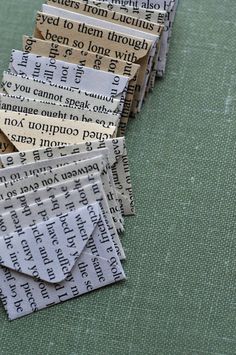 there are many pieces of paper stacked on top of each other with words written in them