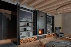 a living room filled with furniture and a fire place in the middle of it's walls