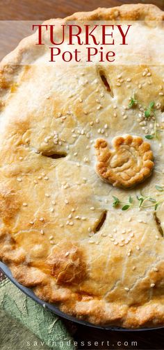 a turkey pot pie on a table with the words turkey pot pie written above it