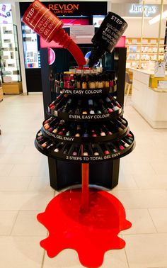 a display in a store filled with lots of different types of cosmetics and makeup products