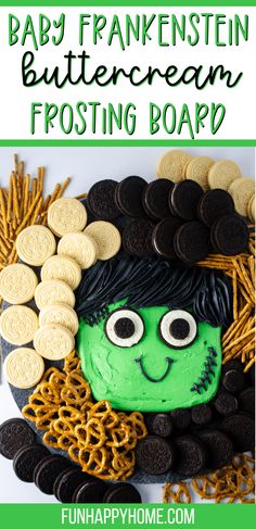 a green and black halloween postcard with cookies in the shape of a face on it