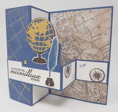 a close up of a card with a map and a globe on the inside of it