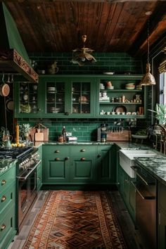 a kitchen with green cabinets and wooden ceilinging is pictured in this image, the area rug has been placed on the floor