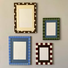 four different colored frames hanging on the wall