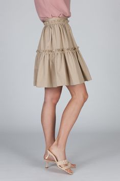 The Elena Skirt has a romantic silhouette and a playful feel. This tiered skirt with a fixed waistband and a concealed back zip closure, is cut from our crisp cotton poplin. It sits high at your waist and features trapunto top stitching to create texture. The gathered fabric allows for subtle volume --twirling will just come natural. Spring Tiered Voluminous Skirt, Chic Tiered Voluminous Skirt, Chic Voluminous Tiered Skirt, Chic Pleated Hem Tiered Mini Skirt, Chic Tiered Mini Skirt With Pleated Hem, Cotton Tiered Voluminous Skirt, Chic Gathered Cotton Mini Skirt, Spring Cotton Mini Skirt With Pleated Hem, Chic Cotton Ruffled Mini Skirt