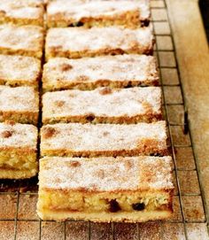 several pieces of cake sitting on top of a cooling rack