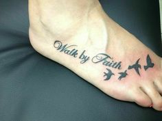 a foot with birds on it that says walk by faith