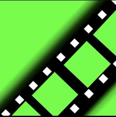 a film strip with white squares on a green backgrounge background that appears to be blurry