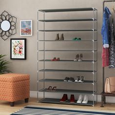 a shoe rack with several pairs of shoes on it in a living room next to a chair