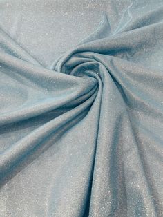 Shimmer Glitter Fabric This beautiful Shimmer Glitter Fabric is 80% Polyester / 20% spandex with Sheen. This fabric is great for costume wear, swimwear, dance wear, special occasions and almost every other activewear you can imagine! Details 80% Polyester / 20% spandex4-Way Stretch SpandexWidth: 58-60 inches.Length: 36 inches - each yard Please Note: *The digital images we display have the most accurate color possible. However, due to differences in computer monitors,there may be variations in c Light Blue Glitter Fabric, Social Dress, Fashion Dream Job, Powder Blue Color, Shimmer Fabric, Social Dresses, Pinterest Ideas, Shiny Fabric, Glitter Fabric