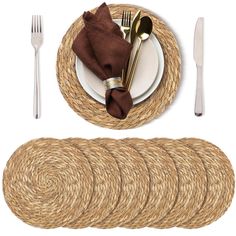 the place setting is ready to be served with silverware, napkins and gold - plated utensils