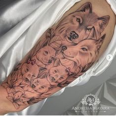 an arm with some animals and flowers on it