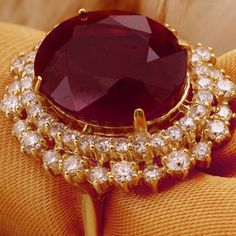 19.26 Carats Impressive Red Ruby and Diamond 14K Yellow Gold Ring Suggested Replacement Value $8,400.00 Total Red Ruby Weight is: 17.36 Carats (glass filled) Ruby Measures: 15.74 x 13.96mm Natural Round Diamonds Weight: 1.90 Carats (color G / Clarity VS2-SI1) Ring total weight: 11.6 grams Disclaimer: all weights, measurements and colors are approximate and may vary slightly from the listed dimensions or as seen in the image. All pictures are magnified to show the smallest of details. Please, ref Luxury Red Diamond Ring With Vvs Clarity, Ruby Party Ring, Luxury Ruby Ring With Vvs Clarity, Luxury Red Ruby Ring With Vvs Clarity, Aaa Quality Red Jewelry For Formal Occasions, Aaa Quality Luxury Diamond Ring For Formal Occasions, Formal Red Rings, Formal Ruby Birthstone Ring, Luxury Gia Certified Ruby Ring