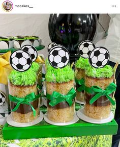 there are some cupcakes with soccer decorations on them