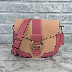 Brand New With The Tag Authentic Color Is Im/Faded Blush/Taffy - A Mauve Pink And Peach Orange Combination Gold Tone Hardware Refined Pebble Leather And Smooth Leather Inside Multifunction Pockets Snap Closure, Fabric Lining Outside Open Pocket Detachable Strap With 20 3/4" Drop For Shoulder Or Crossbody Wear 8 1/4" (L) X 6 3/4" (H) X 2 3/4" (W) Same Or Next Day Shipping! Coach Bag Orange, Chic Pink Saddle Bag For Everyday Use, Pink Satchel Saddle Bag With Detachable Strap, Pink Saddle Bag With Detachable Strap, Pink Saddle Bag With Detachable Strap Satchel, Retro Pink Shoulder Bag With Detachable Strap, Pink Crossbody Saddle Bag With Detachable Strap, Pink Everyday Use Saddle Shoulder Bag, Pink Saddle Bag For Everyday Use