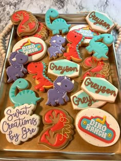 a tray filled with lots of decorated cookies