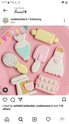 decorated cookies on a pink plate with bunting pins and other items in the shape of cooking utensils