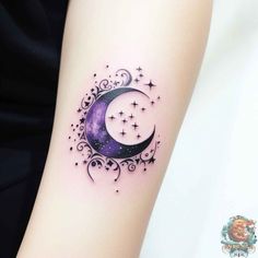 a woman's arm with a crescent and stars tattoo on it