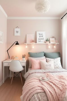 a bedroom with pink walls, white furniture and pictures on the wall above the bed