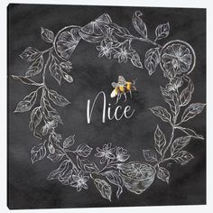 a chalkboard with the words nice written in it and a bee on top of some leaves