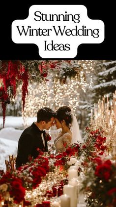 a couple standing next to each other in front of a table with candles and flowers